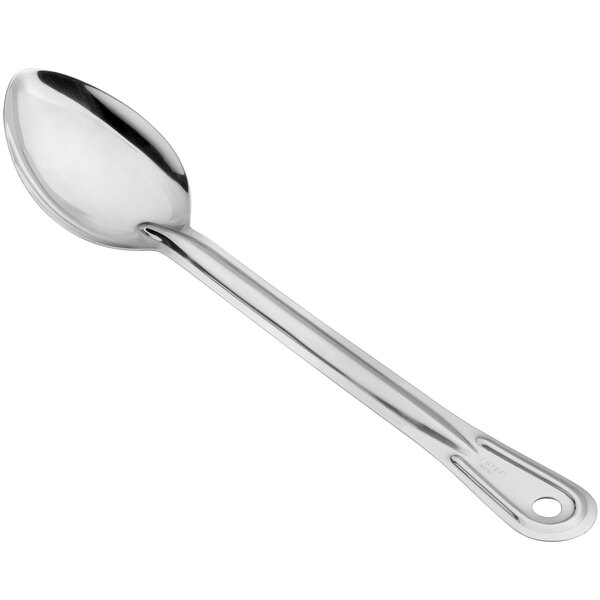 A solid stainless steel basting spoon with a long handle and a hole at the end for hanging.