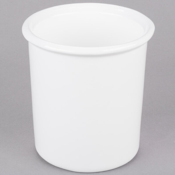 A white cast aluminum bowl with a handle.