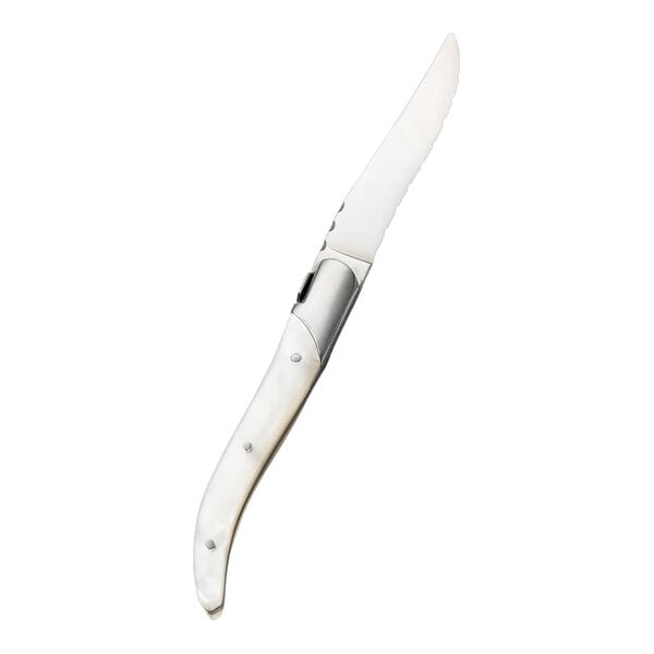 A stainless steel steak knife with a white acrylic handle.