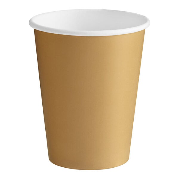 A brown paper cup with a white rim and gold glitter.