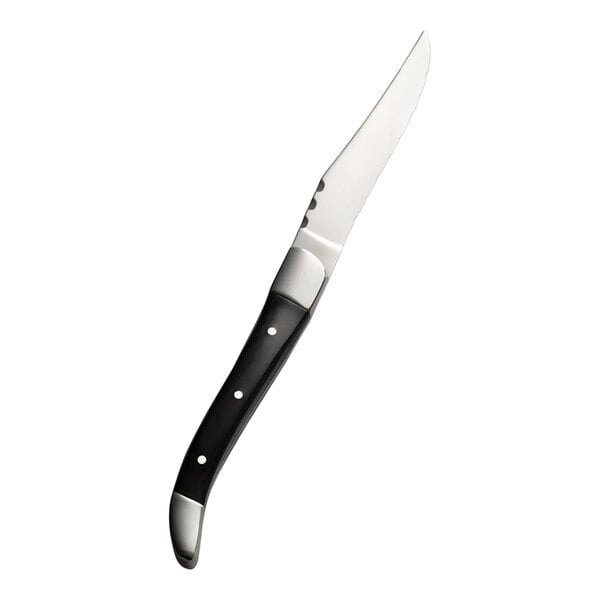 A stainless steel steak knife with a black wood handle.