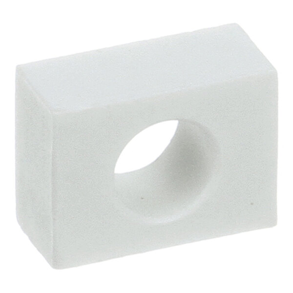 A rectangular white oven conveyor bearing block with a central circular hole.