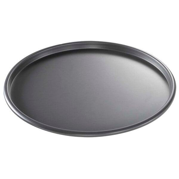 A black round Chicago Metallic pizza pan.
