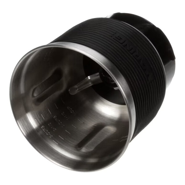 A stainless steel grinding bowl assembly with measurement markings and a black textured exterior, designed for use with Waring appliances.