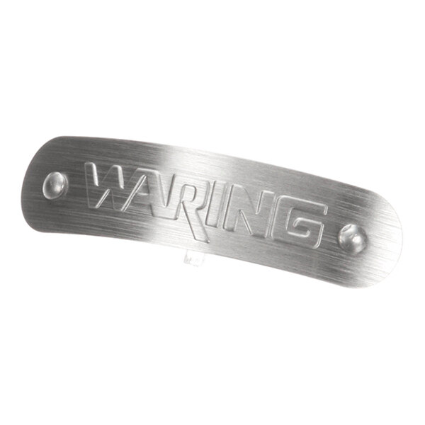A brushed metal nameplate panel with the word 'Waring' embossed on it, designed for a Waring WSB40 appliance.