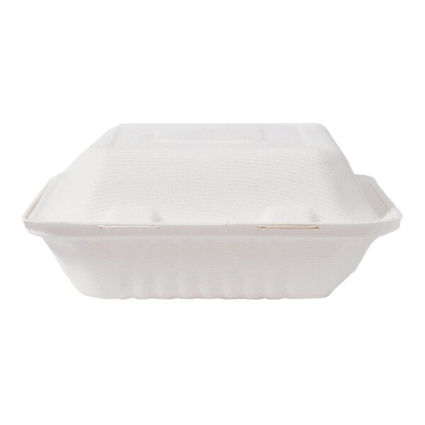 A white compostable clamshell take-out container made from sugarcane fiber.