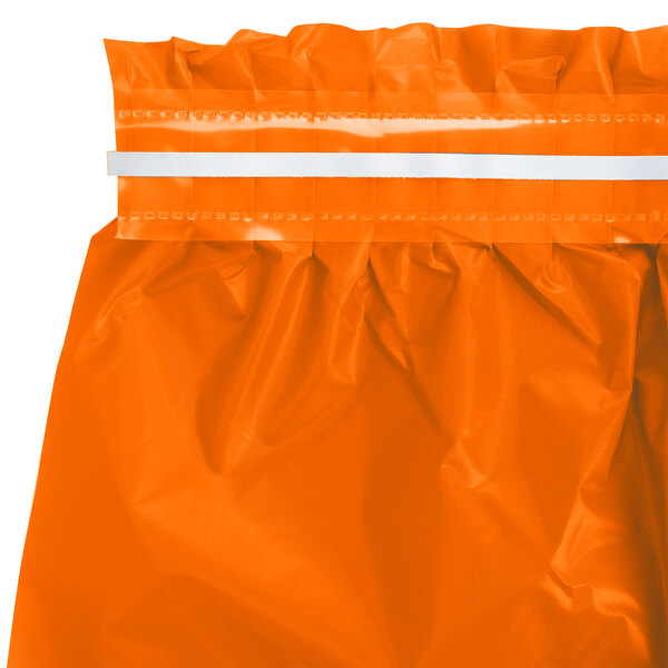 A bright orange disposable plastic table skirt with a pleated top and adhesive strip.