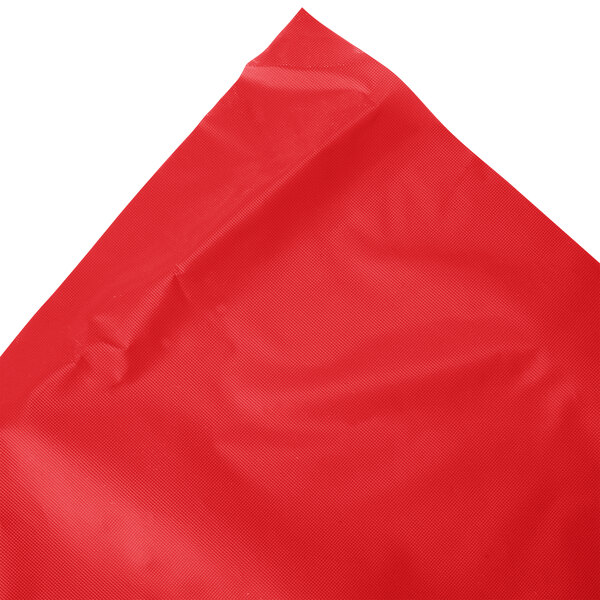A classic red disposable plastic table skirt.