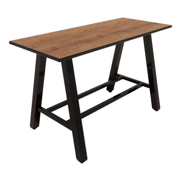 A rectangular bar height table with a planked urban oak laminate top and black metal legs.