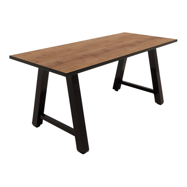 A rectangular table with a planked urban oak laminate top and black angled legs.