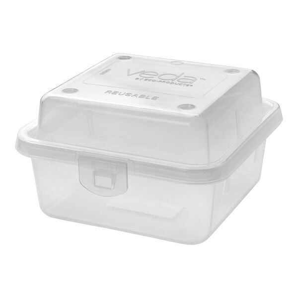 A clear, square, hinged reusable take-out container made of plastic.