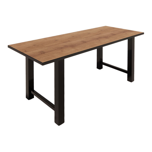 A rectangular table with a planked urban oak laminate top and black metal legs.