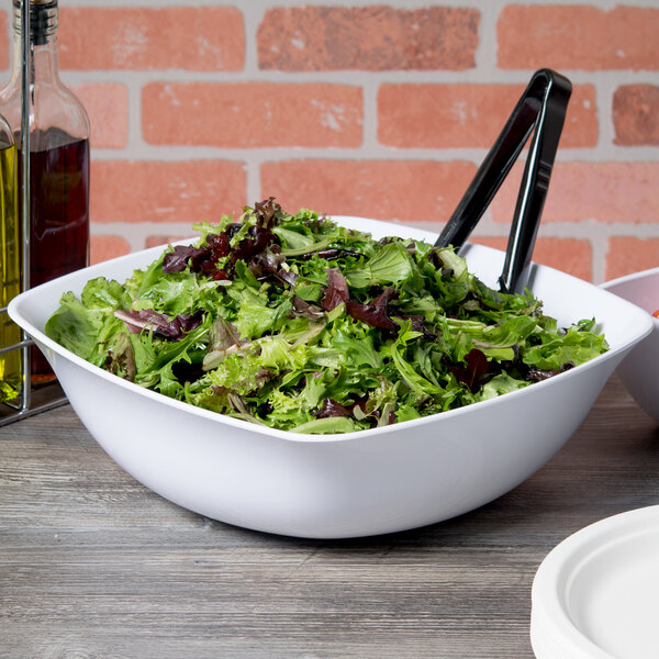 A white Carlisle flared bowl filled with salad.