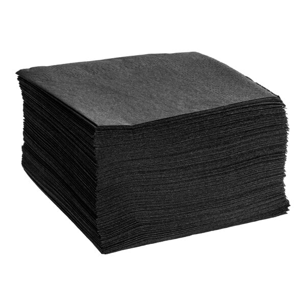A stack of black square 1-ply paper beverage or cocktail napkins.