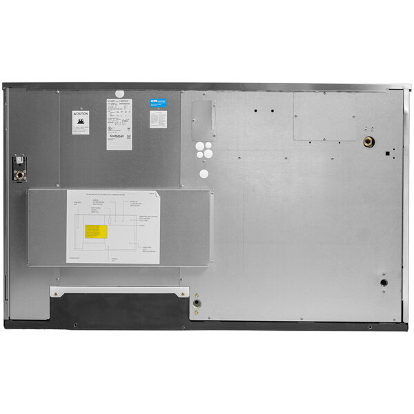 A large, rectangular commercial ice machine unit with a metallic exterior and various access panels and labels.