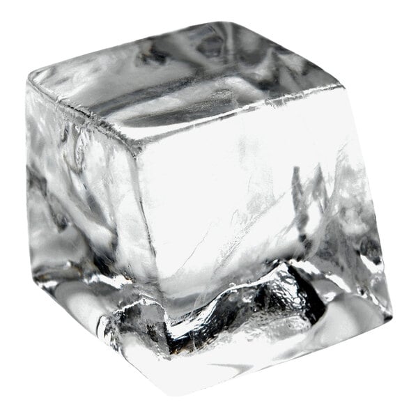 A clear, square ice cube produced by a commercial ice machine.