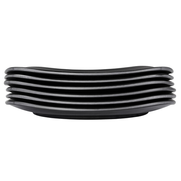 A stack of Elite Global Solutions black square melamine plates.