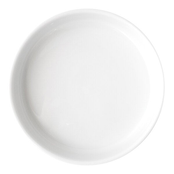 A round, white porcelain plate with a slightly raised rim.