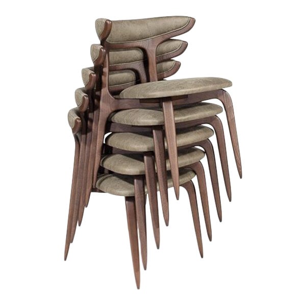 A stack of green faux leather dining chairs with brown wooden frames.