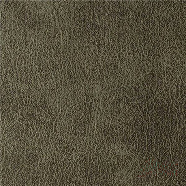 A close-up view of green faux leather upholstery material.