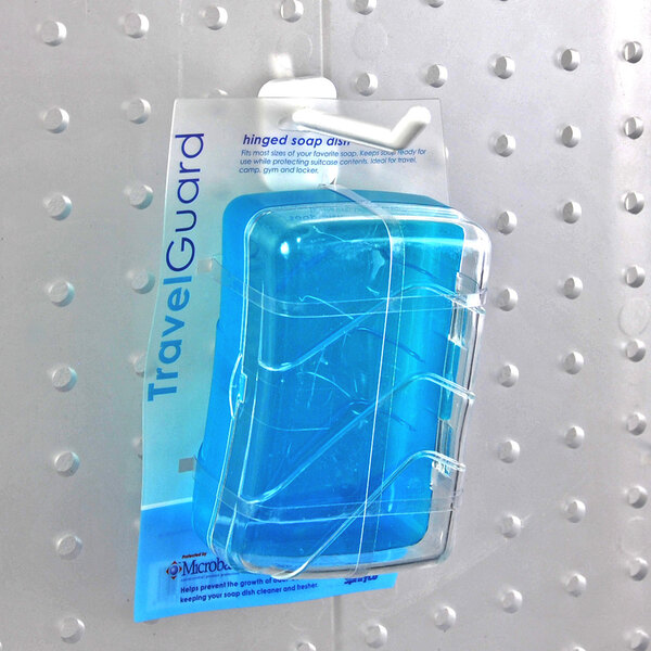 A package of white polycarbonate locking peg hooks displayed on a perforated board.