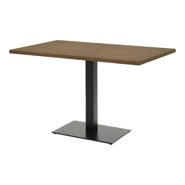 A rectangular table with a walnut-finished MDF top and a black metal pedestal base.