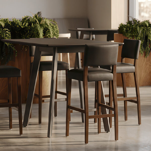 A dark brown beech wood bar stool with a black faux leather seat and back.