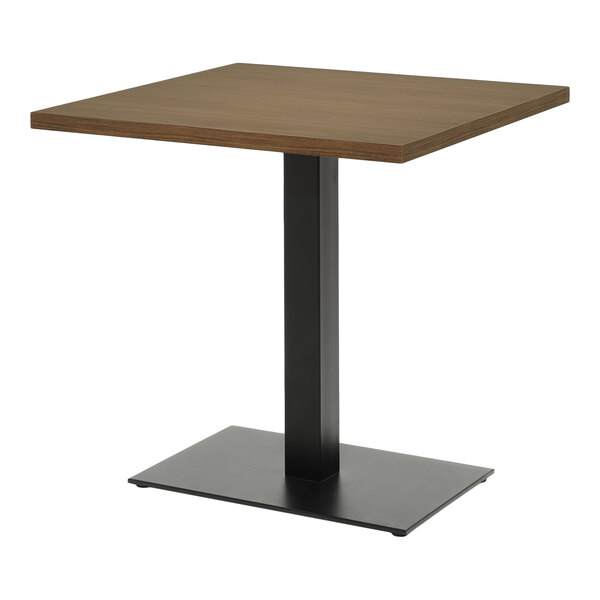 A rectangular table with a walnut-finished laminate MDF top and a black metal pedestal base.