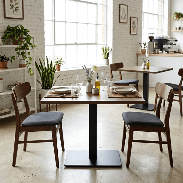 A rectangular high-pressure laminate MDF table top with a walnut finish, set in a modern dining area with two chairs.