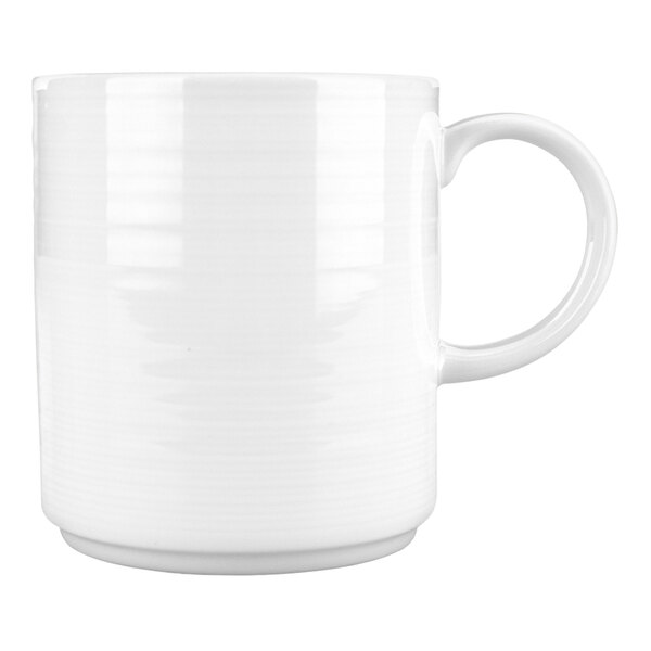A plain white porcelain mug with a handle.