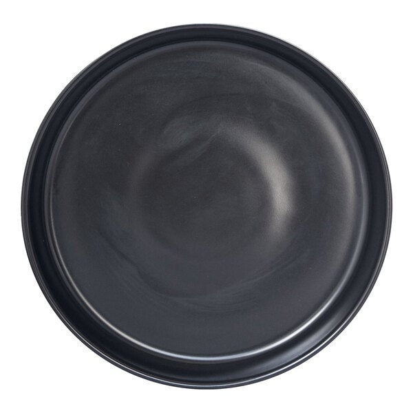 A round porcelain plate with a matte black finish.