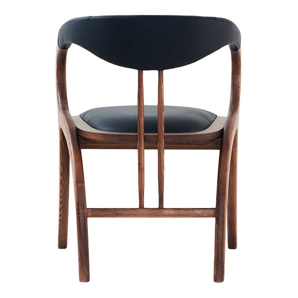 A black faux leather arm chair with a natural wooden frame.