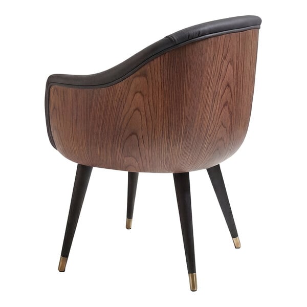 A gray faux leather bubble arm chair with a rounded black wooden frame and tapered legs with gold tips.