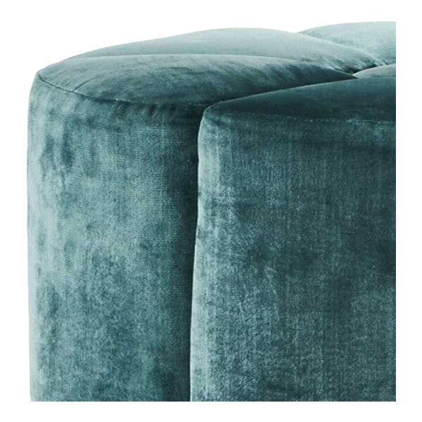 A blue suede fabric modular flower-shaped pouf or ottoman.
