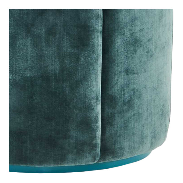 A blue suede fabric modular flower pouf or ottoman.