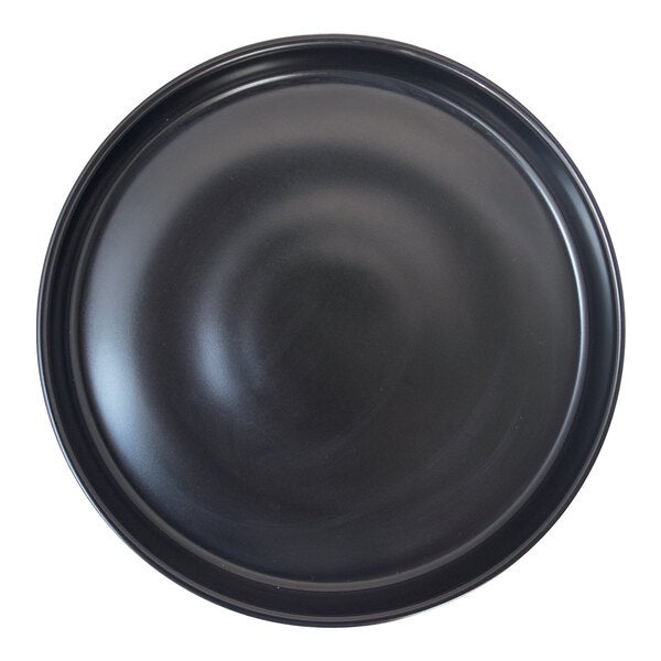A round porcelain wall plate with a matte black finish.