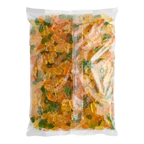 A large clear plastic bag filled with assorted Albanese Island Tropics natural flavor gummi bears.