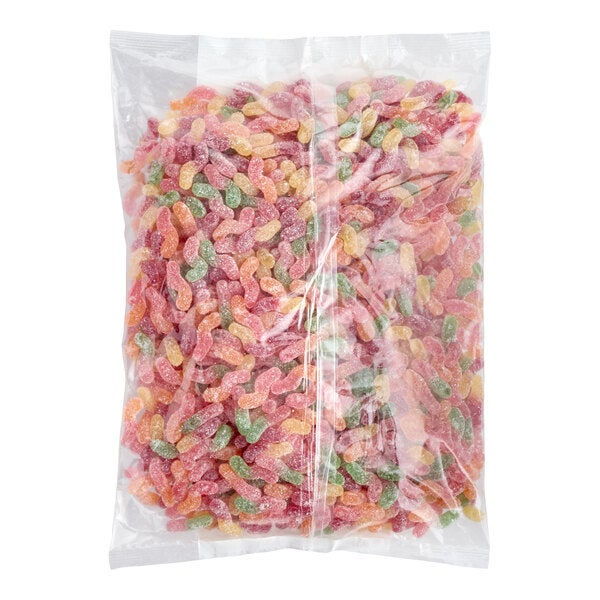 A clear plastic bag filled with assorted sour gummy worms in various colors.