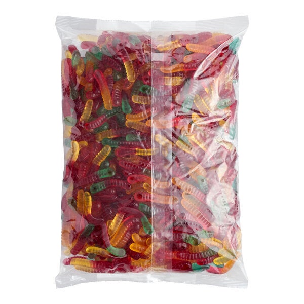 A large clear plastic bag filled with assorted mini gummy worms in various colors.