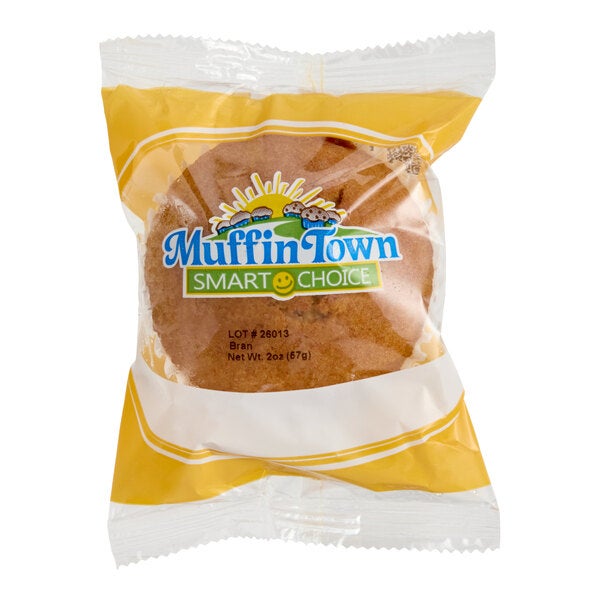 A packaged Muffin Town Smart Choice bran muffin in a yellow and white wrapper.