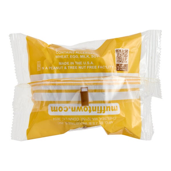 An individually wrapped bran muffin in yellow and clear packaging from Muffin Town.