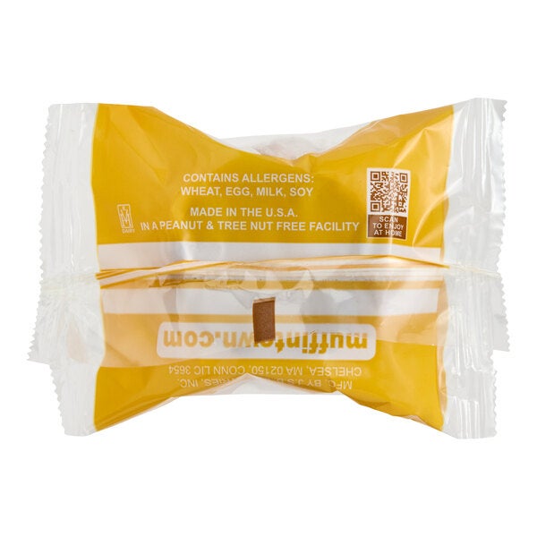 An individually wrapped cranberry orange muffin in clear and yellow packaging.