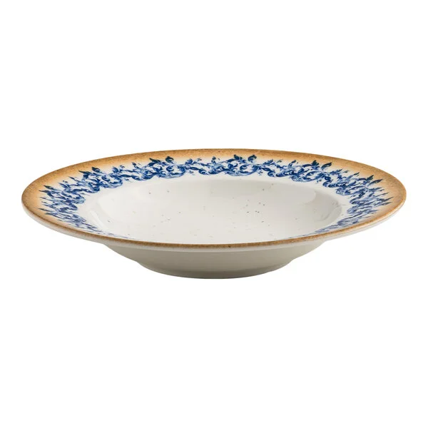 A round white porcelain bowl with a blue floral pattern near the center and a tan rim.