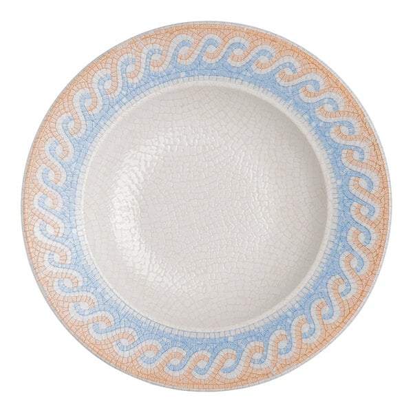 A round white porcelain bowl with a blue and tan wave design around the rim.