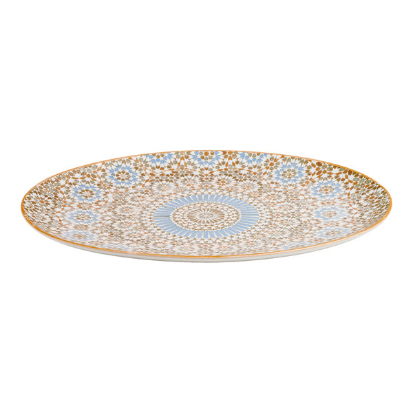 An oval porcelain platter with a blue and orange radial geometric design.
