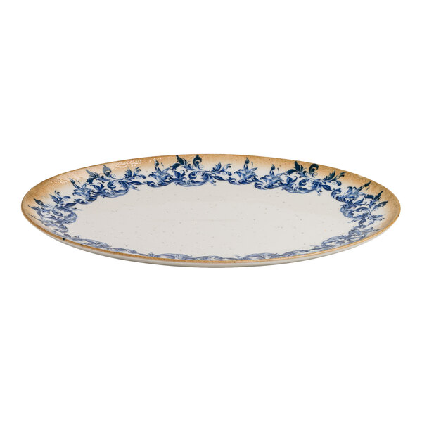 An oval white porcelain platter with a blue floral edge and a tan rim.