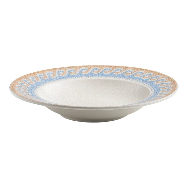 A round white porcelain bowl with a blue and tan wave design on the rim.