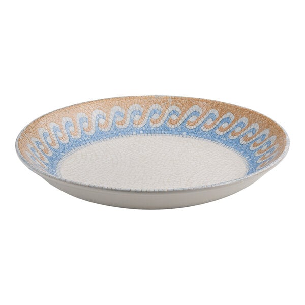 A round white porcelain deep coupe plate with a blue and tan wave design along the rim.