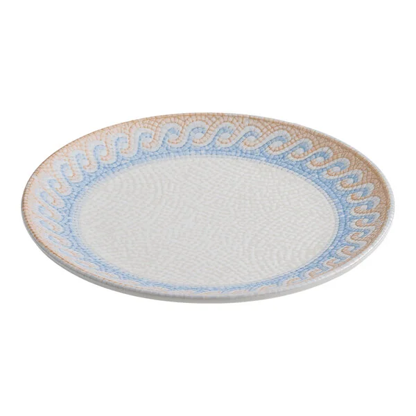 A round white porcelain coupe plate with a blue and tan wave design around the rim.