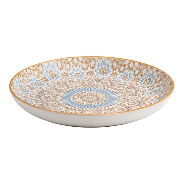 A round porcelain flat coupe plate with a blue and orange radial geometric design.